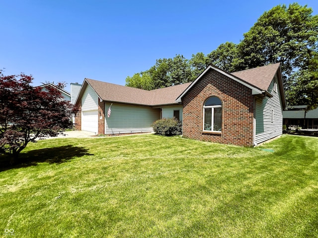 8809 Jonathon Pl, New Haven, IN 46774 - view of front facade featuring brick siding, an attached garage, a front lawn, and roof with shingles
