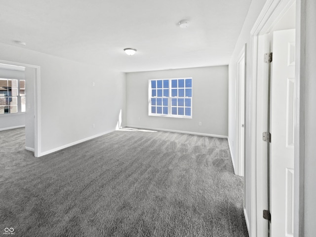 8251 Garden Ridge Rd, Indianapolis, IN 46237 - empty room with baseboards and dark carpet
