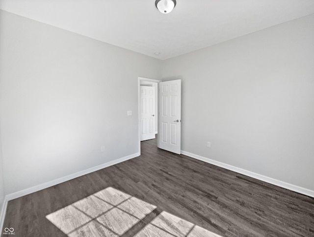 8251 Garden Ridge Rd, Indianapolis, IN 46237 - unfurnished room featuring dark wood-style floors and baseboards