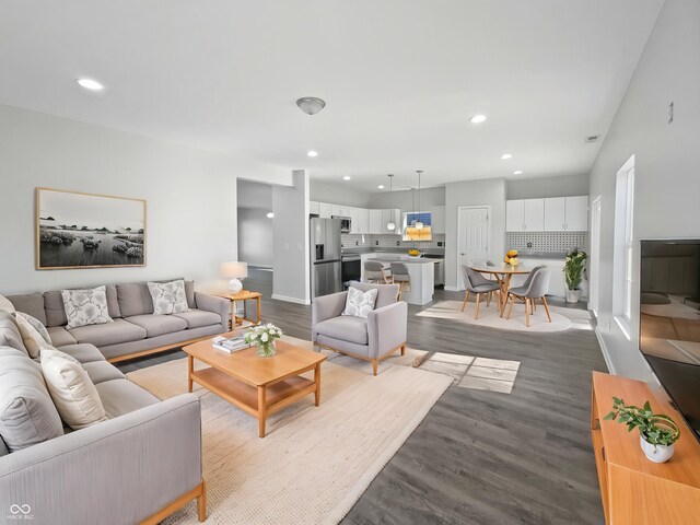 8251 Garden Ridge Rd, Indianapolis, IN 46237 - living room featuring recessed lighting, dark wood-type flooring, and baseboards