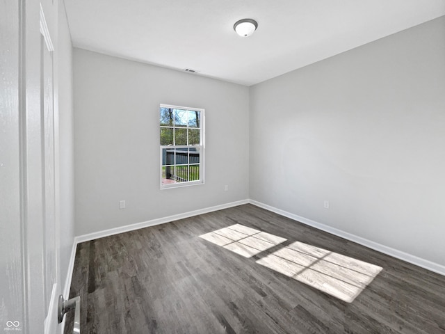 8251 Garden Ridge Rd, Indianapolis, IN 46237 - unfurnished room with baseboards and dark wood finished floors