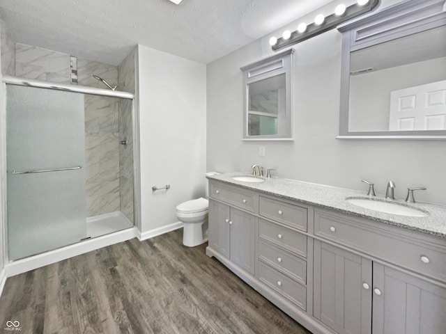 8251 Garden Ridge Rd, Indianapolis, IN 46237 - bathroom with a shower stall, double vanity, a sink, and toilet