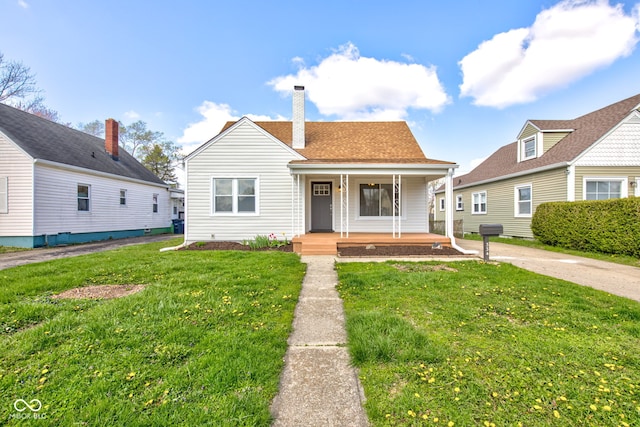 bungalow-style house with a front yard and a porch