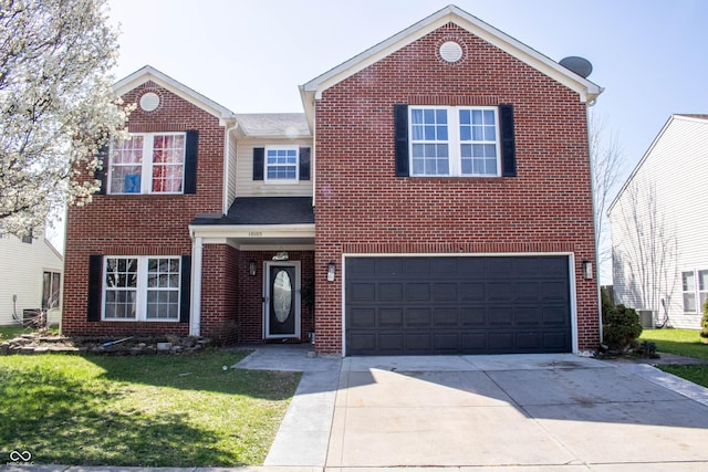 10105 Yosemite Ln, Indianapolis, IN 46234 - traditional home featuring a garage, cooling unit, a front yard, brick siding, and driveway