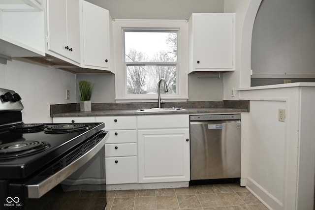 kitchen with stainless steel dishwasher, white cabinetry, a sink, dark countertops, and black / electric stove
