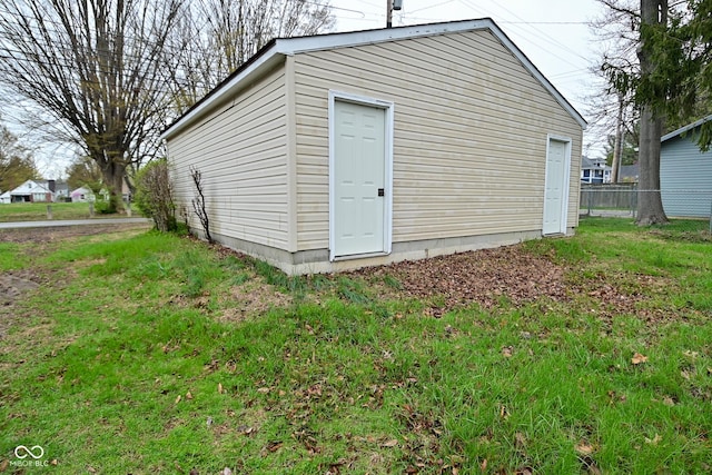 view of outbuilding with an outdoor structure and fence