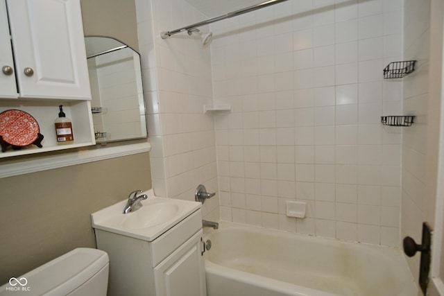 full bath with toilet, vanity, and shower / washtub combination