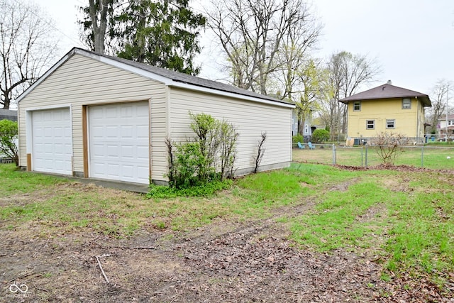 detached garage with fence