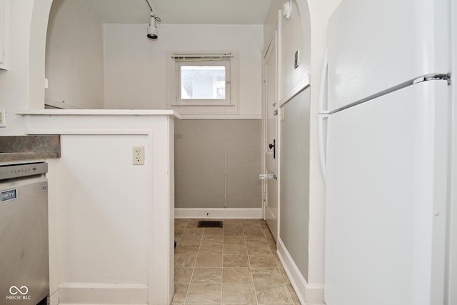 interior space with baseboards and visible vents