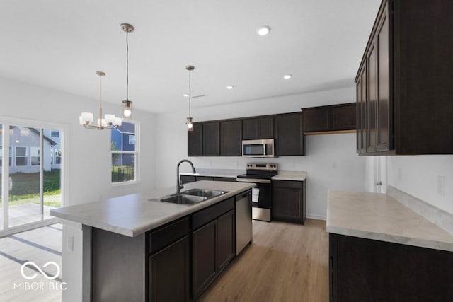 1117 Stubble Run, Danville, IN 46122 - kitchen featuring stainless steel appliances, light wood-style floors, pendant lighting, recessed lighting, and a chandelier