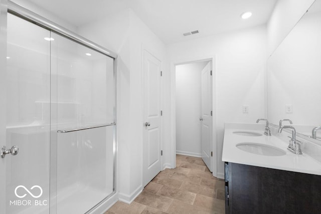 1117 Stubble Run, Danville, IN 46122 - full bath with a shower stall, double vanity, recessed lighting, and stone finish flooring