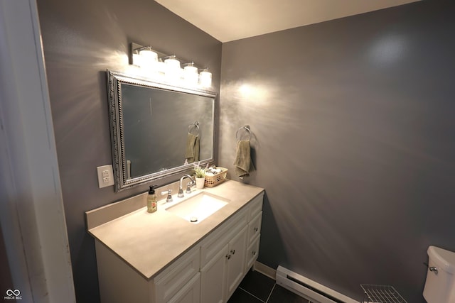 half bathroom featuring vanity, a baseboard radiator, and toilet