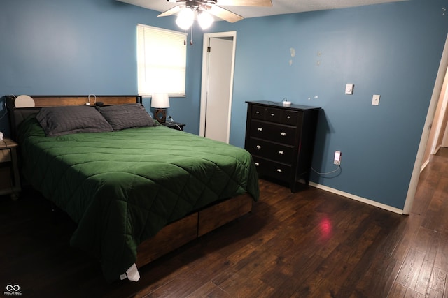 bedroom featuring hardwood / wood-style flooring, baseboards, and ceiling fan