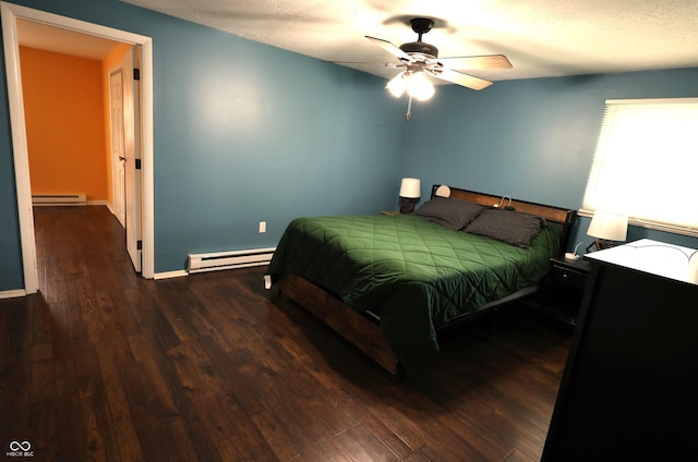 bedroom featuring ceiling fan, wood finished floors, a baseboard heating unit, a baseboard radiator, and baseboards