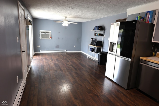 kitchen with an AC wall unit, a baseboard radiator, ceiling fan, dark wood-style floors, and stainless steel appliances