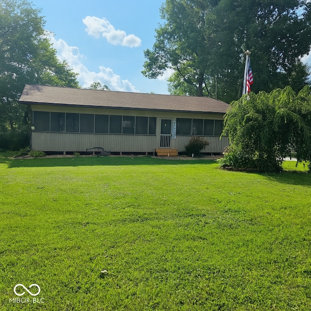 474 Mill, Coatesville, IN 46121 - view of front of home with a sunroom and a front yard