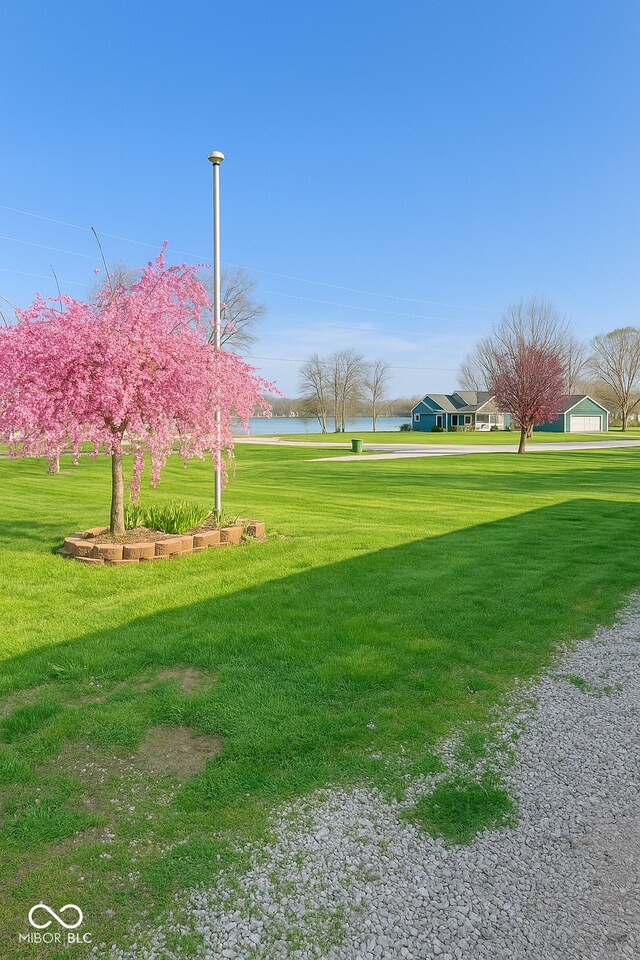 474 Mill, Coatesville, IN 46121 - surrounding community with a lawn and a water view