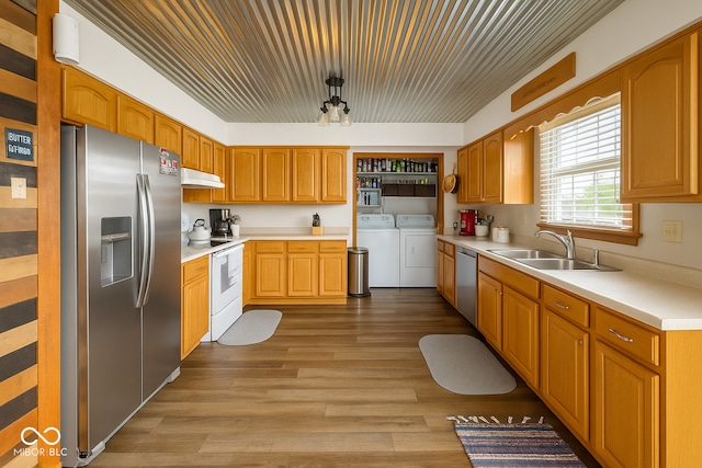 474 Mill, Coatesville, IN 46121 - kitchen featuring stainless steel appliances, washer and dryer, wood finished floors, and light countertops