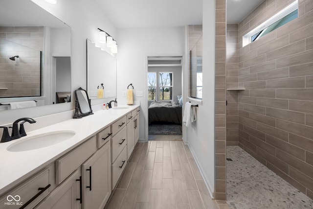 7210 Covington St, Lebanon, IN 46052 - full bath with a walk in shower, ensuite bathroom, a sink, and a healthy amount of sunlight