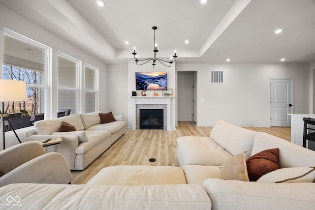 7210 Covington St, Lebanon, IN 46052 - living room with a chandelier, recessed lighting, visible vents, and light wood-style flooring