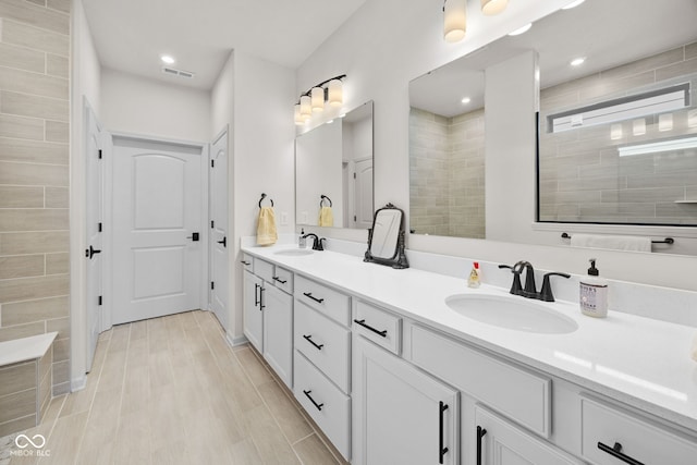 7210 Covington St, Lebanon, IN 46052 - full bath with a sink, visible vents, double vanity, and tiled shower