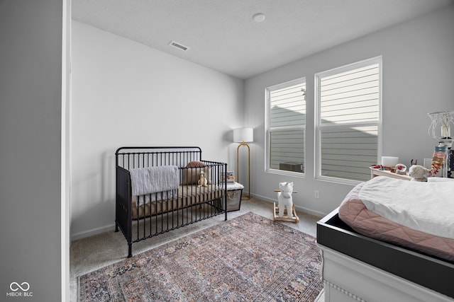 7210 Covington St, Lebanon, IN 46052 - bedroom with carpet, visible vents, baseboards, and a textured ceiling