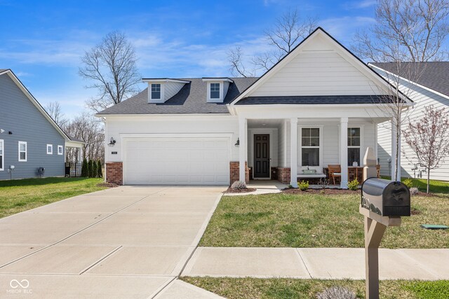 7210 Covington St, Lebanon, IN 46052 - view of front of property with covered porch, a front lawn, an attached garage, a shingled roof, and driveway