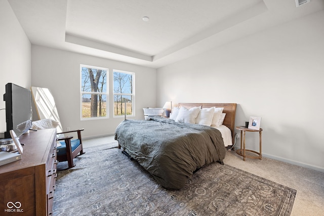 7210 Covington St, Lebanon, IN 46052 - bedroom featuring a tray ceiling, baseboards, carpet, and visible vents