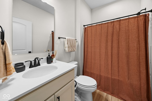 7210 Covington St, Lebanon, IN 46052 - bathroom featuring toilet, a shower with curtain, vanity, and wood finished floors