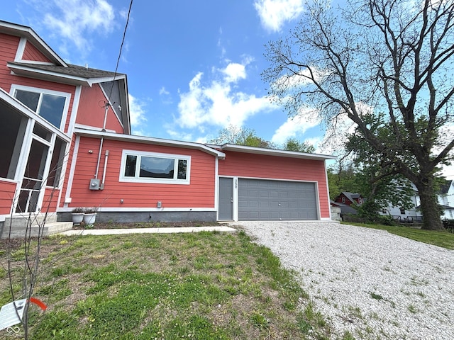 359 N Jefferson St, Martinsville, IN 46151 - view of front of home with gravel driveway and an attached garage