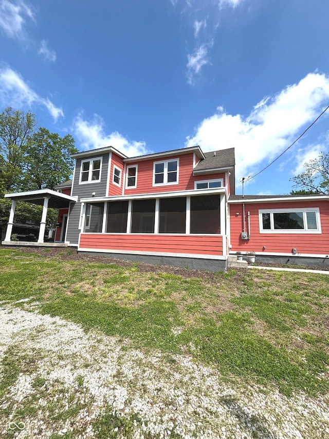 359 N Jefferson St, Martinsville, IN 46151 - rear view of house with a sunroom and a lawn