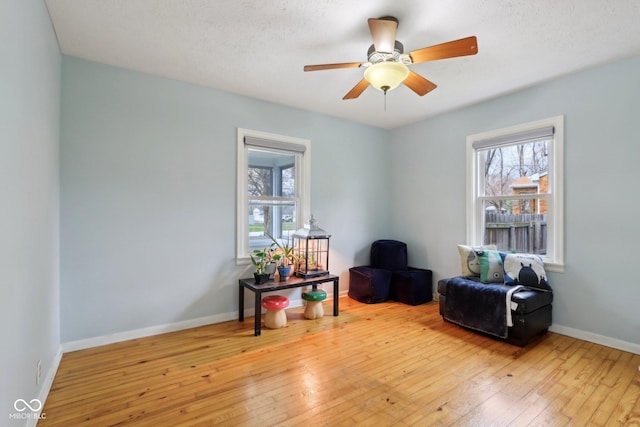 5945 Mcfarland Rd, Indianapolis, IN 46227 - sitting room with hardwood / wood-style floors, a healthy amount of sunlight, and a ceiling fan
