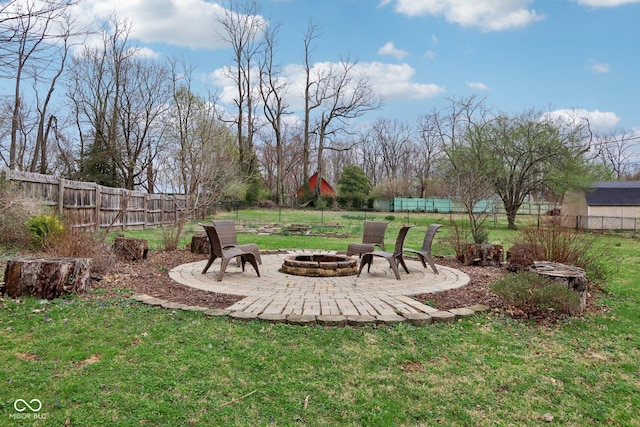 5945 Mcfarland Rd, Indianapolis, IN 46227 - view of yard with a patio area, a fenced backyard, and an outdoor fire pit