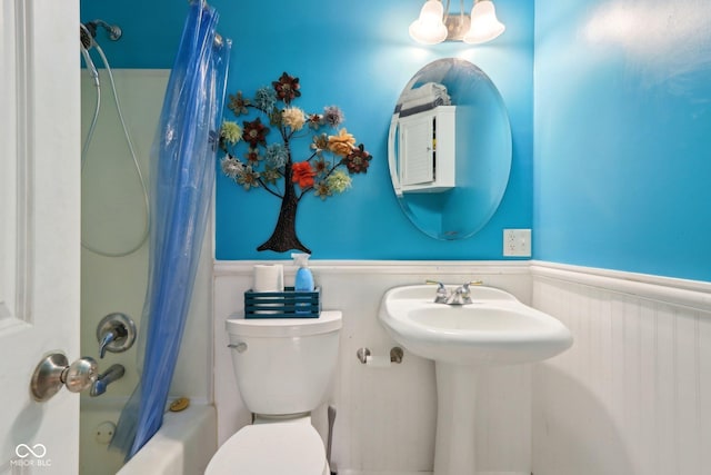 5945 Mcfarland Rd, Indianapolis, IN 46227 - full bathroom featuring shower / tub combo, wainscoting, and toilet
