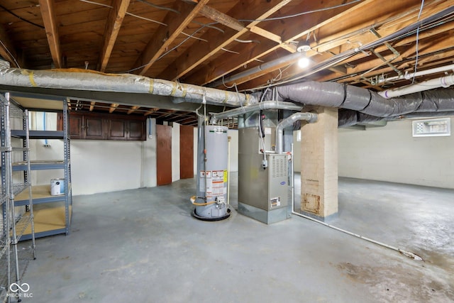 5945 Mcfarland Rd, Indianapolis, IN 46227 - basement featuring water heater and heating unit