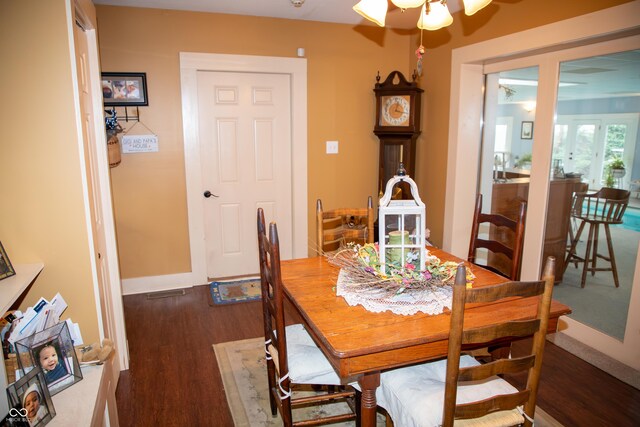 313 E Wabash Ave, Crawfordsville, IN 47933 - dining area with baseboards, a ceiling fan, and wood finished floors
