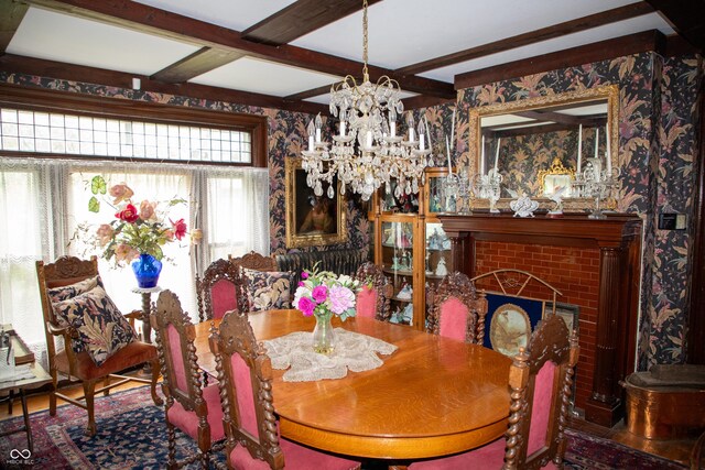 313 E Wabash Ave, Crawfordsville, IN 47933 - dining space with a chandelier, a brick fireplace, beam ceiling, and coffered ceiling