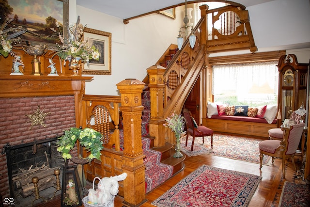 313 E Wabash Ave, Crawfordsville, IN 47933 - sitting room with a fireplace, stairway, and wood finished floors