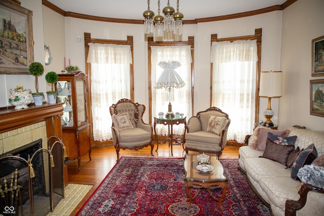 313 E Wabash Ave, Crawfordsville, IN 47933 - living room featuring crown molding, wood finished floors, and a healthy amount of sunlight