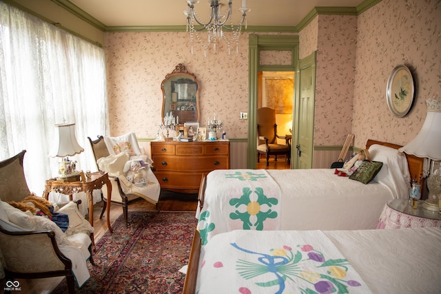 313 E Wabash Ave, Crawfordsville, IN 47933 - bedroom with wainscoting, wallpapered walls, an inviting chandelier, and ornamental molding