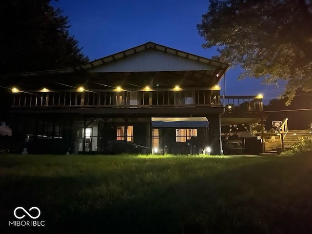 view of back of house at night