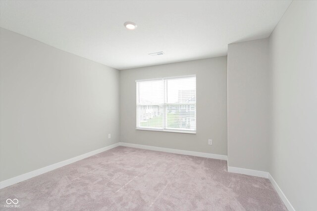 1268 Newton St, Avon, IN 46123 - spare room featuring baseboards, light carpet, and visible vents