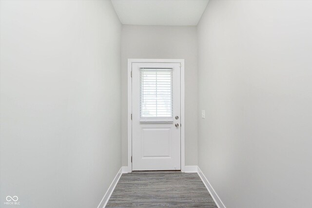 1268 Newton St, Avon, IN 46123 - doorway to outside with baseboards and dark wood-type flooring