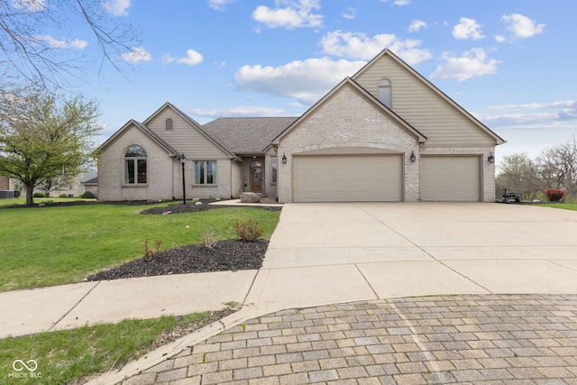 8095 Christopher Ct, Avon, IN 46123 - view of front of house featuring brick siding, a front lawn, driveway, and a garage