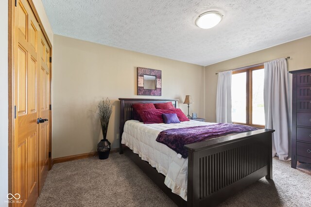 8095 Christopher Ct, Avon, IN 46123 - bedroom with a textured ceiling, carpet flooring, and baseboards