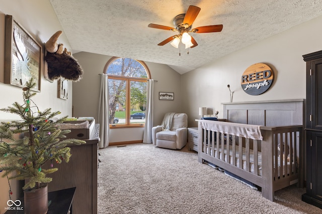8095 Christopher Ct, Avon, IN 46123 - bedroom featuring a crib, vaulted ceiling, carpet flooring, and a textured ceiling