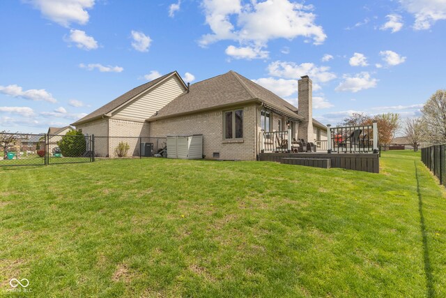 8095 Christopher Ct, Avon, IN 46123 - view of side of home featuring roof with shingles, a fenced backyard, a chimney, brick siding, and a yard