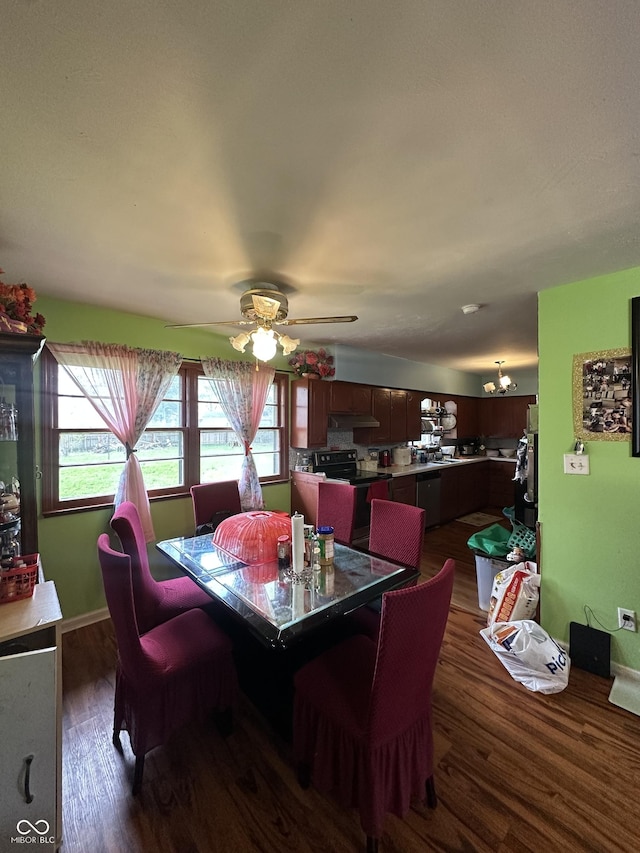 dining room with ceiling fan and dark wood finished floors