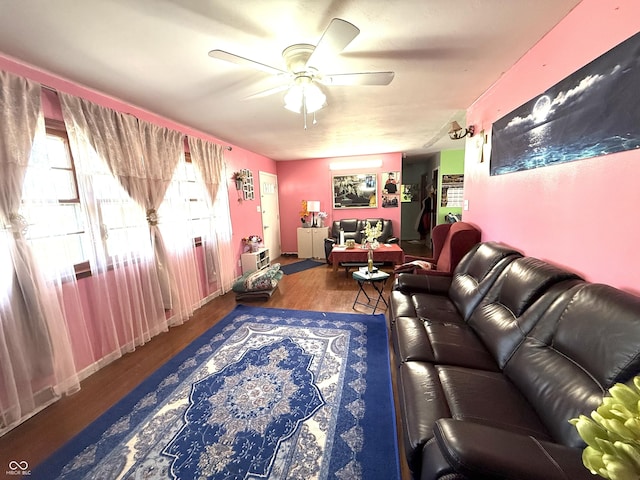 living room featuring a ceiling fan and wood finished floors