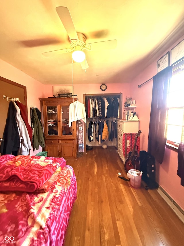 bedroom featuring a ceiling fan and wood finished floors